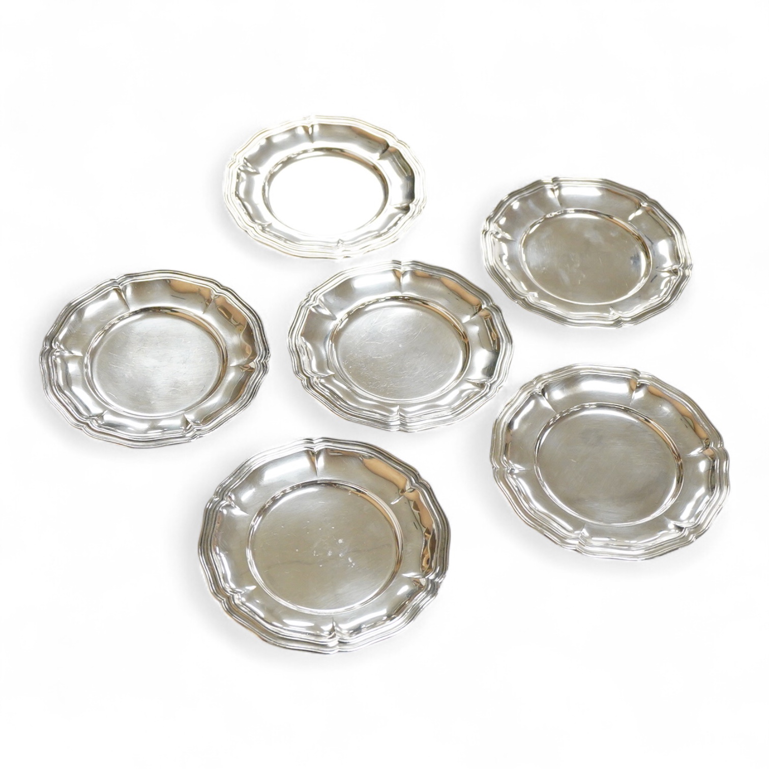 A set of six Peruvian sterling side plates or stands, 15.8cm, 21.1oz.